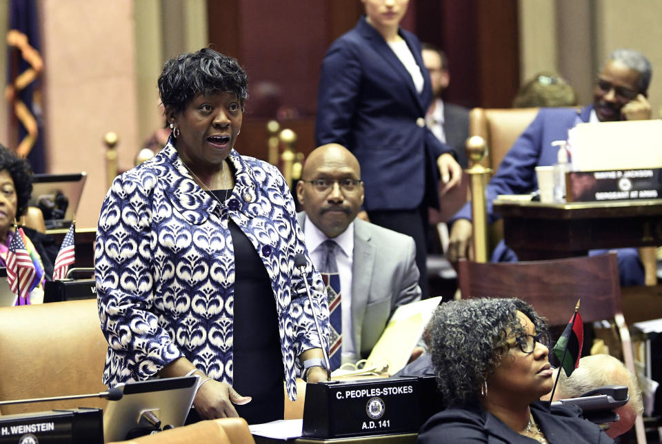 FILE- In this March 31, 2019 file photo, New York Assembly Majority Leader Crystal D. Peoples-Stokes, D- Buffalo, speaks while debating bills in the Assembly Chamber at the state Capitol in Albany, N.Y. Peoples-Stokes agrees legalizing marijuana isn’t a panacea for minority communities. But the Assembly’s first African-American majority leader is championing a recreational-pot proposal that’s currently being revised. (AP Photo/Hans Pennink, File)