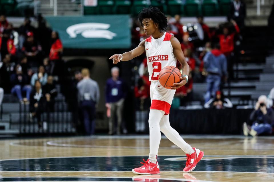 Flint Beecher guard Keyonta Menefield looks to pass against Ecorse during the second half of Beecher's 64-53 win in the Division 3 semifinal at Breslin Center on Thursday, March 23, 2023.