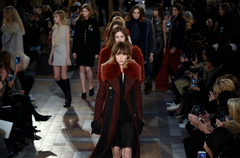 British model Edie Campbell (front) presents a creation for Sonia Rykiel at her autumn/winter ready-to-wear show in Paris in March