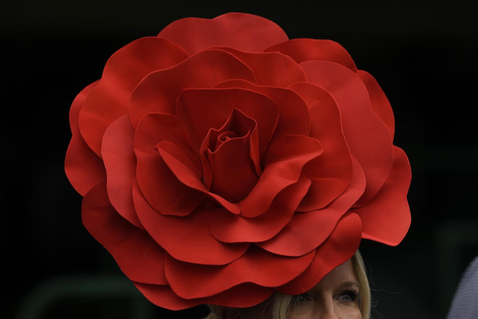 A race fan walks though the grounds of at Churchill Downs before the 150th running of the Kentucky Derby horse race Saturday, May 4, 2024, in Louisville, Ky. (AP Photo/Charlie Riedel)