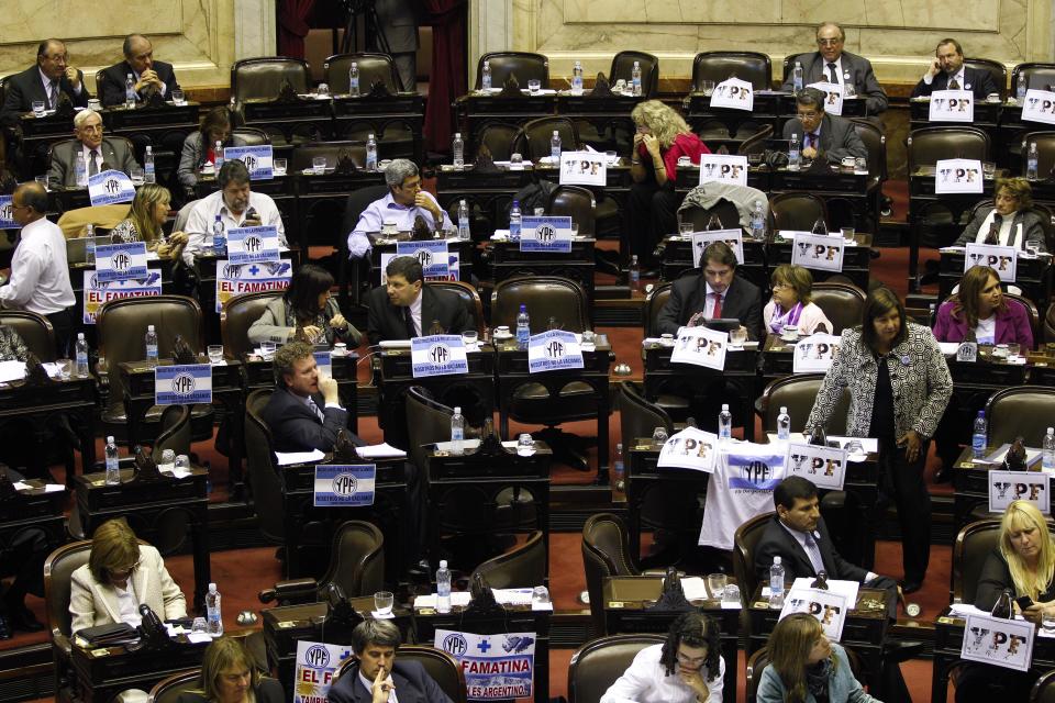 Lawmakers debate the YPF bill on the expropriation of the oil company in Buenos Aires, Argentina, Thursday, May 3, 2012. President Cristina Fernandez, who pushed forward a bill to renationalize the country's largest oil company, said the legislation put to congress would give Argentina a majority stake in oil and gas company YPF by taking control of 51 percent of its shares currently held by Spain's Repsol. (AP Photo/Natacha Pisarenko)