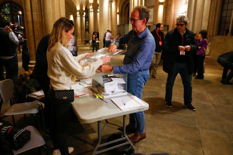 The ballots boxes are opened to count votes during general election in Barcelona