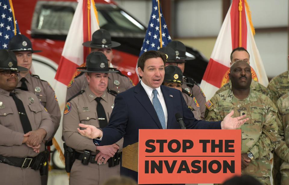 Florida Gov. Ron DeSantis addressed the audience backed by members of the Florida Highway Patrol, the Florida National Guard, and the Florida State Guard. DeSantis held a press conference in a hangar at Cecil Commerce Center on Jacksonville, Florida's westside Thursday, Feb. 1, 2024, to announce plans to deploy members of the Florida National Guard and the Florida State Guard to the borders of Texas and other areas to help slow down the tide of individuals entering the United States illegally. [Bob Self/Florida Times-Union]