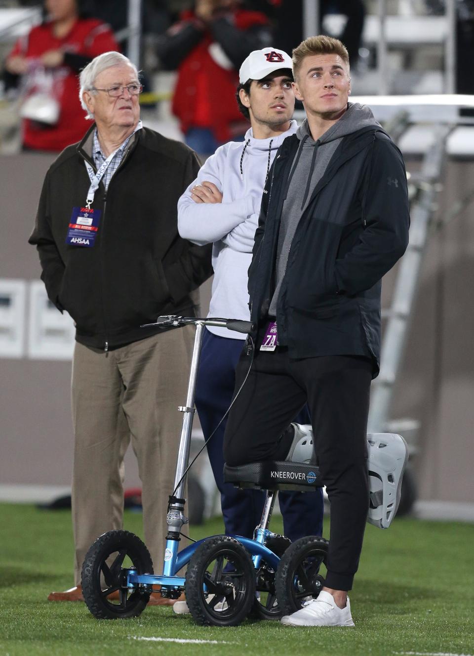 Bo Nix, injured Auburn quarterback, was on hand for the Thompson vs Central Phoenix City 7A state championship game in Birmingham Wednesday, Dec. 1, 2021. Nix's father Patrick is the head coach and his brother Central quarterback Caleb Nix (11) is the team's starting quarterback. [Staff Photo/Gary Cosby Jr]