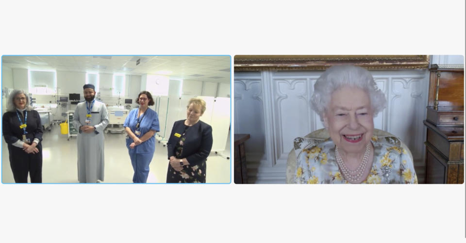 In this image from video issued by Buckingham Palace on Sunday, April 10, 2022, Britain's Queen Elizabeth II speaks to Polly Fitch, clinical psychologist; Imam Faruq Siddiqi, chaplain; Mireia Lopez Rey Ferrer, Senior Sister and Jackie Sullivan during a video link call and virtual visit to the Royal London Hospital on Wednesday April 6, 2022, to mark the official opening of the hospital's Queen Elizabeth Unit. (Buckingham Palace via AP)