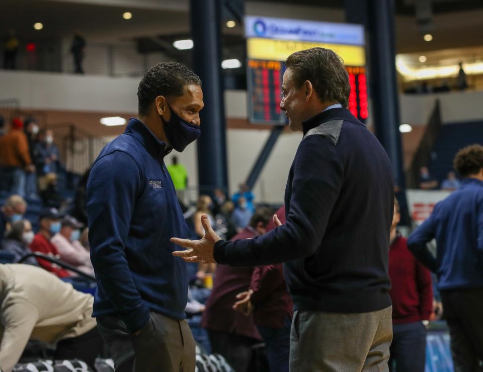 Monmouth coach King Rice (left) and Iona coach Rick Pitino talk prior to their game at OceanFirst Bank Center in West Long Branch on Jan. 18, 2022.