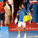 Djokovic enters Rod Laver Arena.