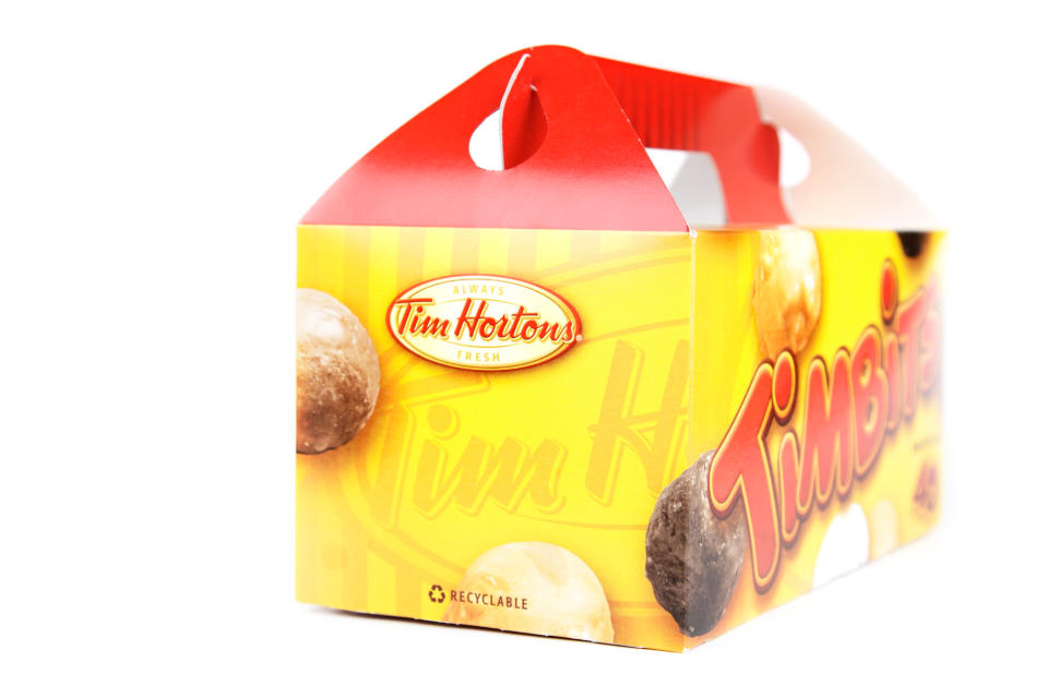 A box of Tim Hortons timbits sits isolated on a white background.