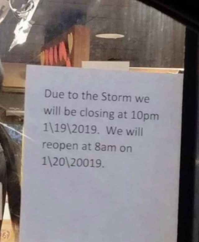 Sign on door stating closure at 10 pm due to the storm and reopening at 8 am the next day with incorrect year 20019