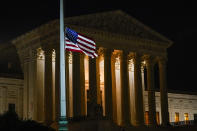 The American flag blows in the wind after it was lowered to half-staff Friday, Sept. 18, 2020, in Washington, after the Supreme Court announced that Supreme Court Justice Ruth Bader Ginsburg has died of metastatic pancreatic cancer at age 87. (AP Photo/Alex Brandon)