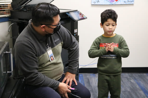 Mountain View Elementary School parent educator Ted Pedro drops in on a student. (Burke County Public Schools)