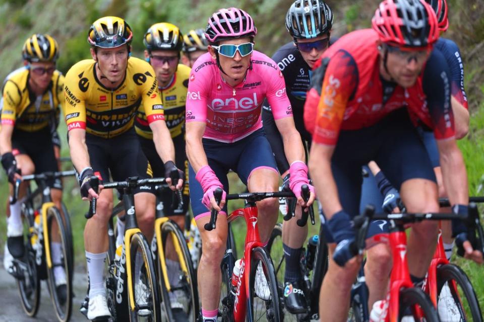 Overall leader INEOS Grenadierss British rider Geraint Thomas C and fellow riders of the pack cycle during the thirteenth stage of the Giro dItalia 2023 cycling race which start was transfered from Borgofranco dIvrea to Le Chable due to bad weather conditions and CransMontana on May 19 2023 Photo by Luca Bettini  AFP Photo by LUCA BETTINIAFP via Getty Images