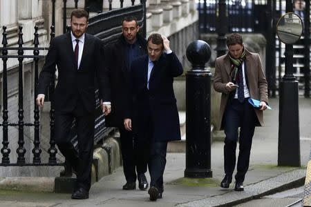 Emmanuel Macron (C), candidate in France's 2017 French presidential arrives at 10 Downing Street in central London, Britain, February 21, 2017. REUTERS/Stefan Wermuth