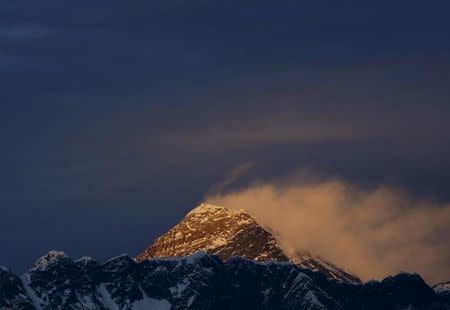 Light illuminates Mount Everest, during the in Solukhumbu District also known as the Everest region, in this picture taken November 30, 2015. REUTERS/Navesh Chitrakar/File Photo