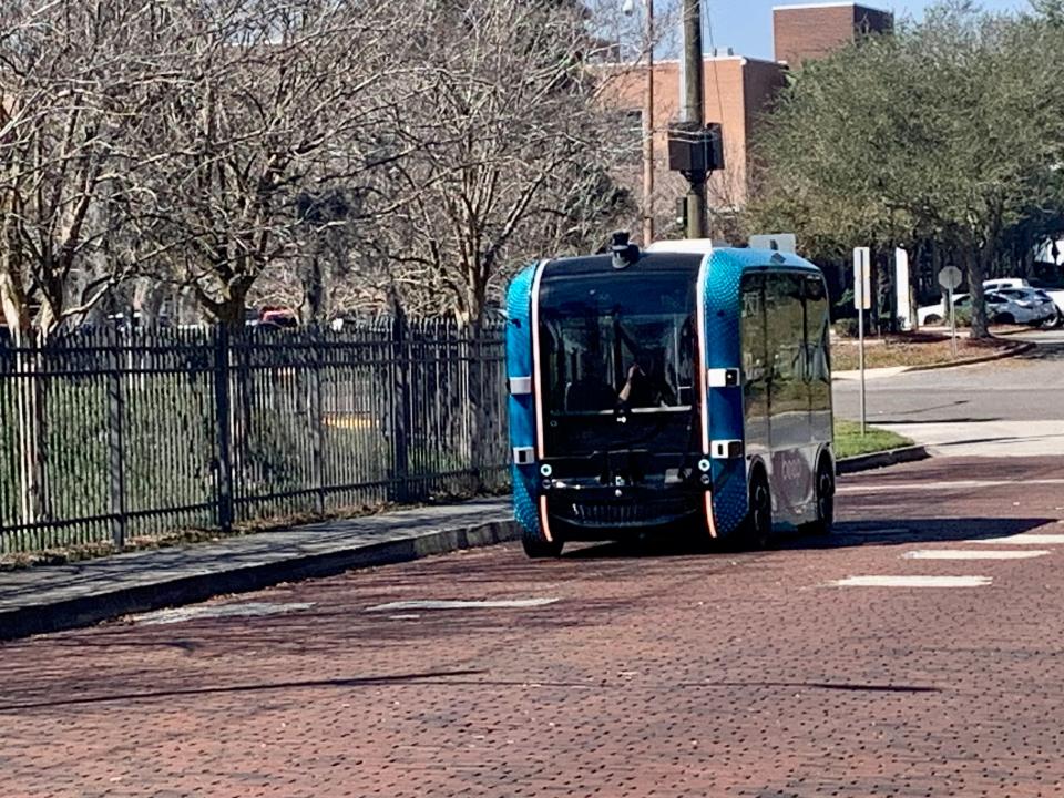 An autonomous vehicle that uses sensor technology for guidance makes its way down red-bricked Bethel Baptist Street after crossing North Pearl Street on its route through the Florida State College at Jacksonville Campus. FSCJ joined with the Jacksonville Transportation and Beep to launch the service on Feb. 20.