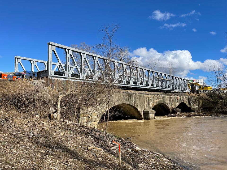 With the temporary bridge in place, construction workers are now installing the temporary bridge deck and approaches to the bridge, which is several feet above the original roadway. The temporary bridge is scheduled to open at the end of April.