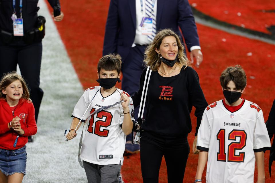 Gisele Bundchen walks with family members after Super Bowl LV at Raymond James Stadium.