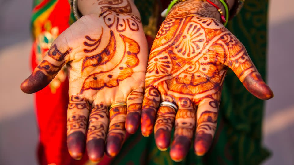 A bride with henna pictured in Agra, Uttar Pradesh, India. - EyesWideOpen/Getty Images