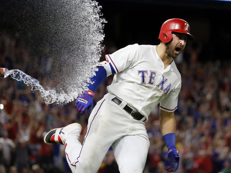 Joey Gallo celebrates after hitting a three-run walk-off homer for the Rangers. (AP)