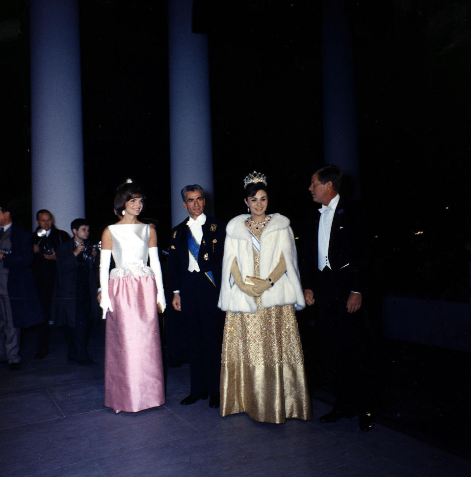 The Kennedys attend a dinner in honor of the Shah and Empress of Iran at the White House.