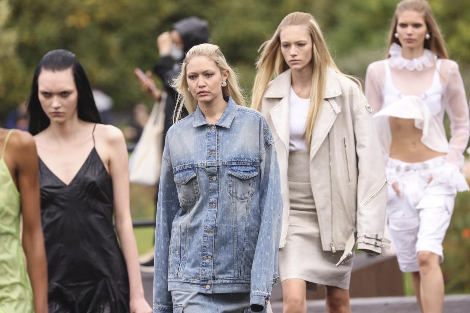 Gigi Hadid, center, walks with other models as they wear creations for the Givenchy ready-to-wear Spring/Summer 2023 fashion collection presented Sunday, Oct. 2, 2022 in Paris. (Photo by Vianney Le Caer/Invision/AP)