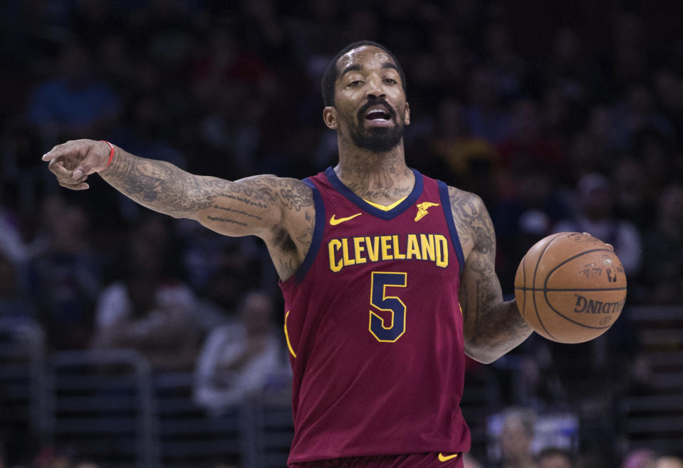 FILE - Cleveland Cavaliers' JR Smith gestures to teammates during the first half of an NBA basketball game against the Philadelphia 76ers, April 6, 2018, in Philadelphia. Smith hopes his journey to become a college golfer helps others feel comfortable taking up the sport regardless of their background. Smith is part of a new video podcast launching Wednesday designed to make the sport more accessible to young and diverse audiences. (AP Photo/Chris Szagola, File)