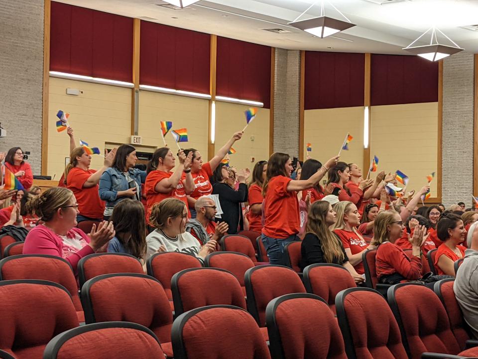 Members of the Westwood community raise pride flags as people speak at the May 11 Westwood Regional Board of Education meeting. The community has expressed frustration with the board's recent comments about the state health curriculum, teachers and LGBTQ families.