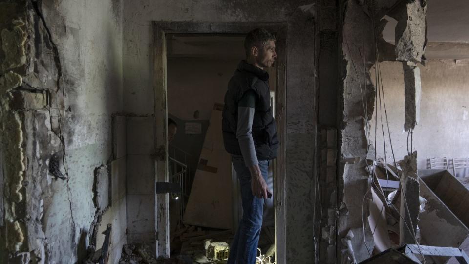 A man inspects his office damaged by a drone during a night attack, in Kyiv, Ukraine, Sunday, May 28, 2023. (Vasilisa Stepanenko/AP)