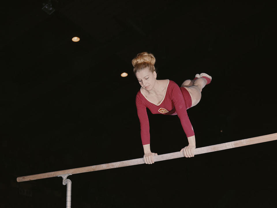 Czechoslovakian gymnast and seven-time Olympic Gold medallist Vera Caslavska competes on the uneven bars in 1968 in London, Great Britain. | Don Morley/Getty Images