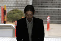 K-pop singer Jung Joon-young arrives to attend a hearing at the Seoul Central District Court in Seoul, South Korea, Thursday, March 21, 2019. A South Korean pop star has appeared at a court hearing to decide whether to arrest him over allegations that he illegally shared sexually explicit videos of women taken without their knowledge or consent in online group chats.(AP Photo/Lee Jin-man)