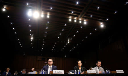 Ryan Petty, whose daughter was killed during the Marjory Stoneman Douglas High School attack, Katherine Posada, a teacher at Marjory Stoneman Douglas High School, and Michael Beckerman, President and CEO of the Internet Association, testify to Senate Judiciary Committee during a hearing about legislative proposals to improve school safety in the wake of the mass shooting at the high school in Parkland, Florida, on Capitol Hill in Washington, U.S., March 14, 2018. REUTERS/Joshua Roberts