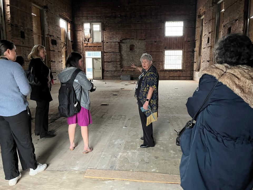 Community volunteer Robyn Dudley takes community members on a tour of the old Telfair Street synagogue following a historic marker dedication by the Augusta Jewish Museum on Sunday, Jan. 22, 2022.