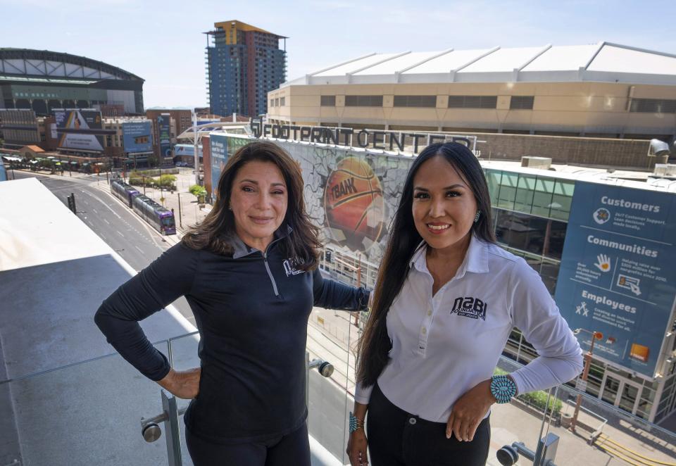 GinaMarie Scarpa, co-founder and CEO of NABI Foundation, (left) and Lynette Lewis, director of basketball operations and program development at NABI Foundation are busy preparing for the Native American Basketball Invitational at Footprint Center.