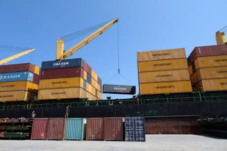 A ship transports empty containers at the seaport of Benghazi