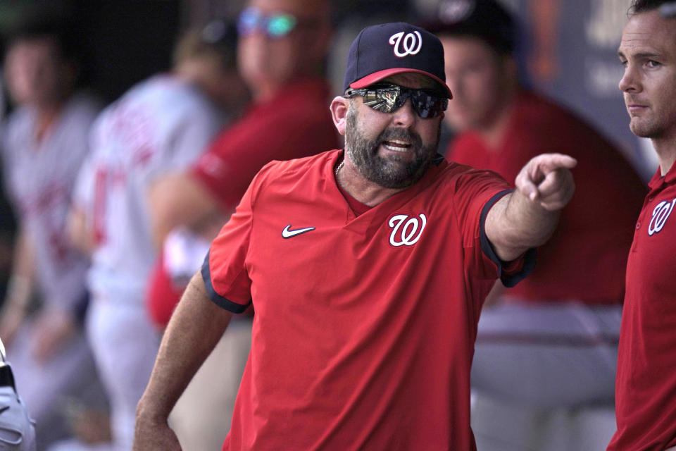 FILE - Washington Nationals hitting coach Kevin Long is ejected as he argues with an umpire during the fifth inning of a baseball game against the New York Mets at Citi Field in New York, in this Thursday, Aug. 12, 2021, file photo. The Philadelphia Phillies hired Kevin Long as their hitting coach on Wednesday, Oct. 13, 2021, reuniting him with both manager Joe Girardi and star slugger Bryce Harper. (AP Photo/Seth Wenig, File)