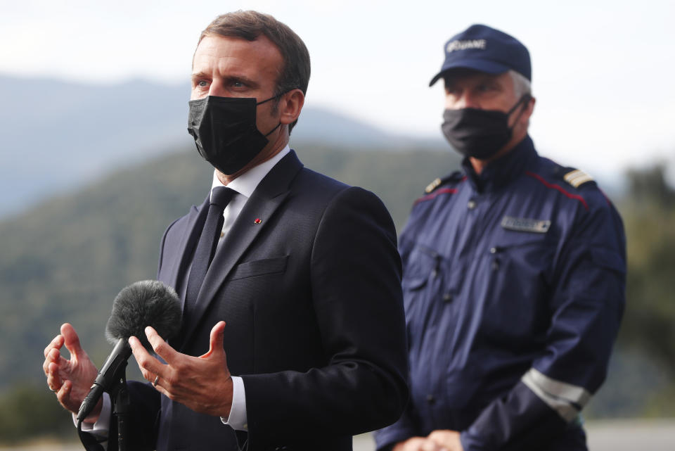 French President Emmanuel Macron addresses to reporters during a visit on the strengthening border controls at the crossing between Spain and France, at Le Perthus, France, Thursday, Nov. 5, 2020. (Guillaume Horcajuelo, Pool via AP)