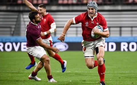 Wales' centre Jonathan Davies scores a try during the Japan 2019 Rugby World Cup Pool D match between Wales and Georgia - Credit: ANNE-CHRISTINE POUJOULAT/AFP/Getty Images