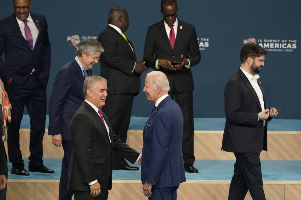 President Joe Biden, center, speaks with Colombian President Ivan Duque as they in a family photo with heads of delegations at the Summit of the Americas, Friday, June 10, 2022, in Los Angeles. (AP Photo/Marcio Jose Sanchez)