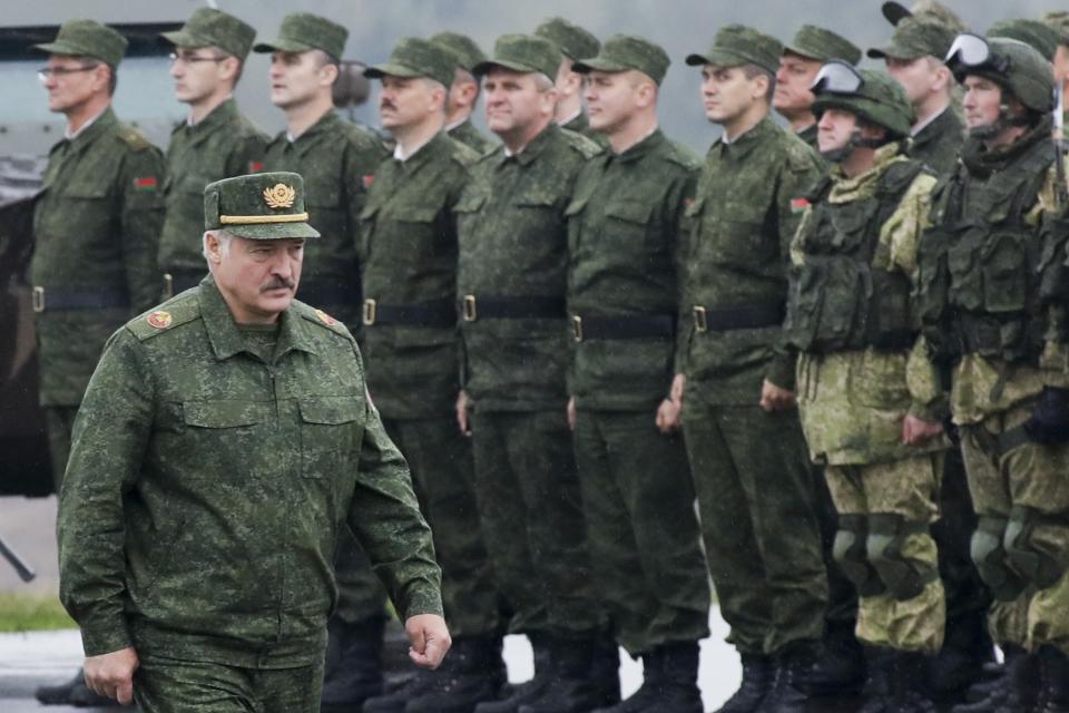 FILE - Belarusian President Alexander Lukashenko inspects the troops during the Zapad (West) 2017 joint Russia-Belarus military drills at the Borisovsky range in Borisov, Belarus, Wednesday, Sept. 20, 2017. Lukashenko this week once again accused Ukraine of planning to attack it and announced creating a joint grouping of troops with Moscow, a move that stocked fears that Belarusian army could join Russian forces in Ukrainian trenches. (AP Photo, File)