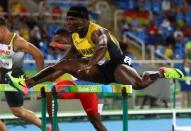 2016 Rio Olympics - Athletics - Preliminary - Men's 110m Hurdles Round 1 - Olympic Stadium - Rio de Janeiro, Brazil - 15/08/2016. Omar McLeod (JAM) of Jamaica competes. REUTERS/Kai Pfaffenbach