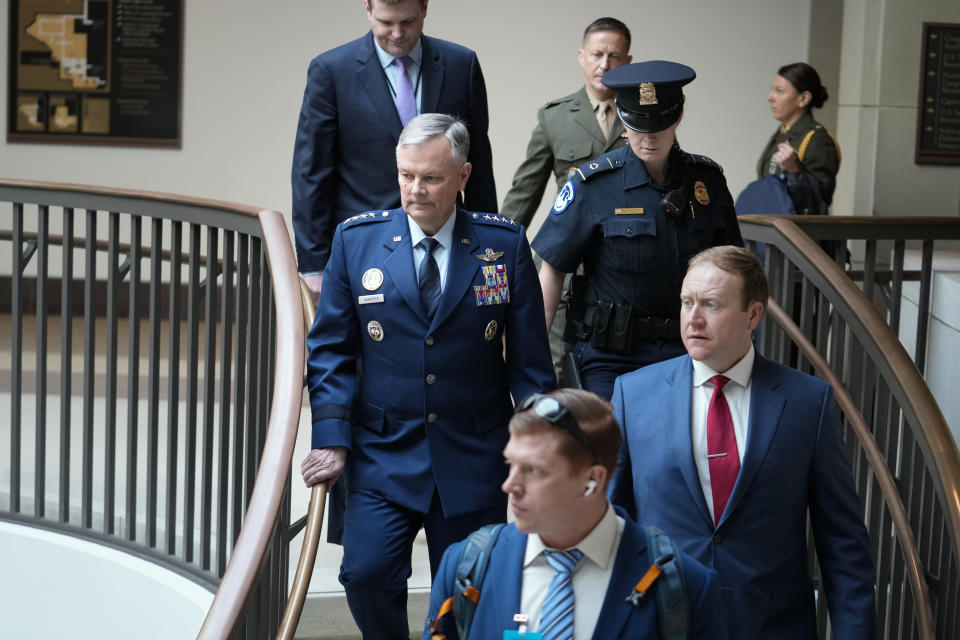 Lawmakers and intelligence advisers, including Gen. Glen VanHerck, left, commander of the United States Northern Command and North American Aerospace Defense Command, arrive for a closed briefing on the Chinese surveillance balloon that flew over the United States recently, at the Capitol in Washington, Thursday, Feb. 9, 2023. (AP Photo/J. Scott Applewhite)