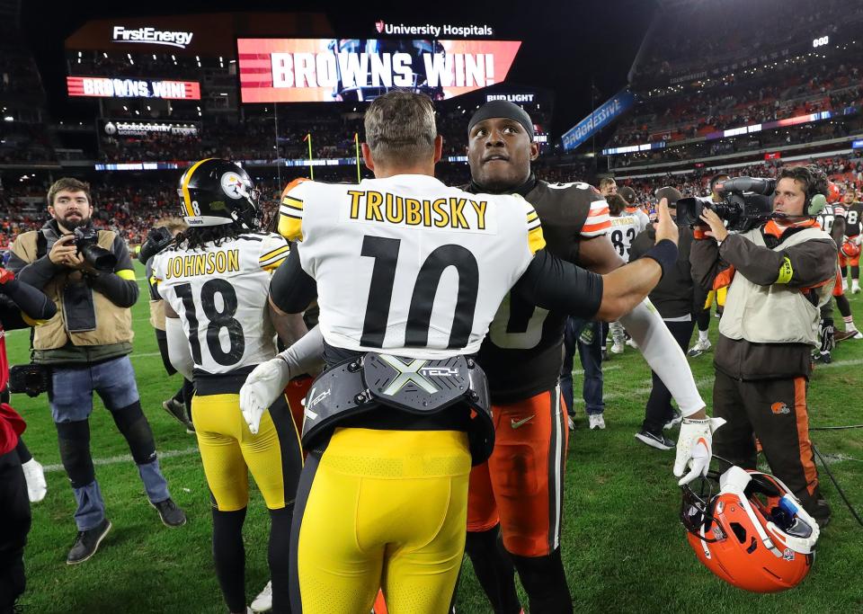 Browns linebacker Jacob Phillips hugs Steelers quarterback Mitch Trubisky following their game Thursday, Sept. 22, 2022, in Cleveland.