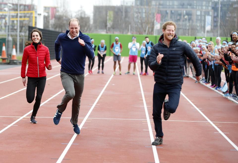 Britain's Prince William, second left, Kate, the Duchess of Cambridge, left, and Prince Harry take part in a relay race, during a training event to promote the charity Heads Together, at the Queen Elizabeth II Park in London, Sunday, Feb. 5, 2017. (AP Photo/Alastair Grant, Pool)