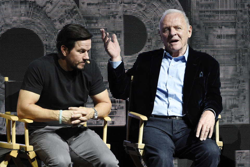 Anthony Hopkins, right, a cast member in "Transformers: The Last Knight," addresses the audience as fellow cast member Mark Wahlberg looks on during the Paramount Pictures presentation at CinemaCon 2017 at Caesars Palace on Tuesday, March 28, 2017, in Las Vegas. (Photo by Chris Pizzello/Invision/AP)