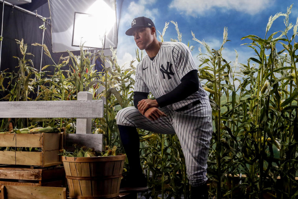 Feb 20, 2020; Tampa, Florida, USA; New York Yankees right fielder Aaron Judge (99) is filmed by Fox for promotion of the Field of Dreams game between the Yankees and the White Sox during media day Mandatory Credit: Butch Dill-USA TODAY Sports