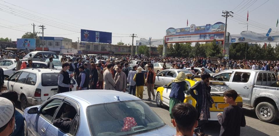 KABUL, AFGHANISTAN - AUGUST 16: Afghans crowd at the tarmac of the Kabul airport on August 16, 2021, to flee the country as the Taliban were in control of Afghanistan after President Ashraf Ghani fled the country. (Photo by Sayed Khodaiberdi Sadat/Anadolu Agency via Getty Images)