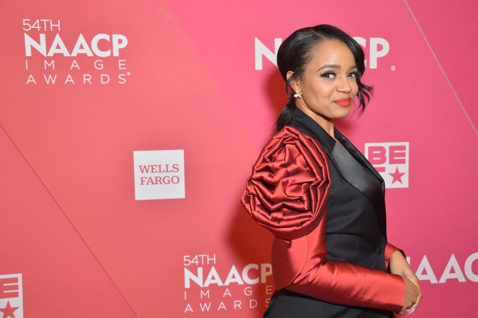 A side profile of Kyla on the 54th NAACP Image Awards. Kyla is wearing a luxe two-tone pantsuit