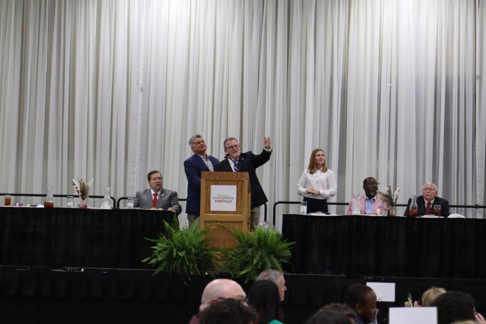 Mayors Jacques Roy (left) and Rich Dupree welcome those at Monday's Alexandria/Pineville Convention and Visitors' Bureau annual tourism luncheon to their respective cities. Louisiana Lt. Gov. Billy Nungesser is to Roy's left, and CVB Executive Director Katie Vanderlick is to Dupree's right.