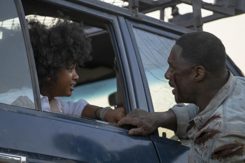 This image released by Universal Pictures shows Leah Jeffries, left, and Idris Elba in a scene from "Beast." (Lauren Mulligan/Universal Pictures via AP)