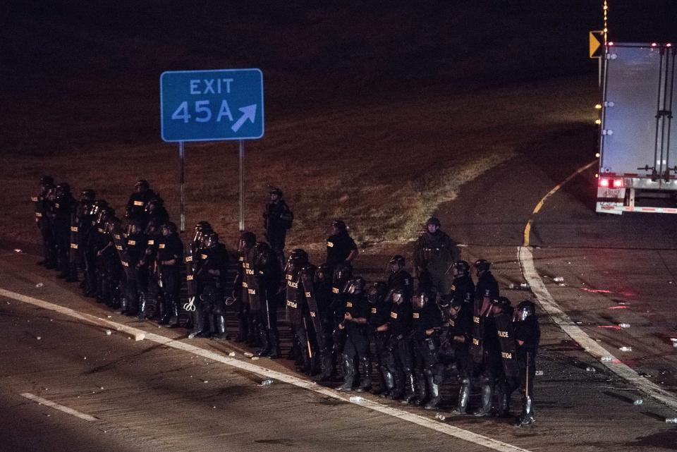 Police officers take position at an onramp on I-85.